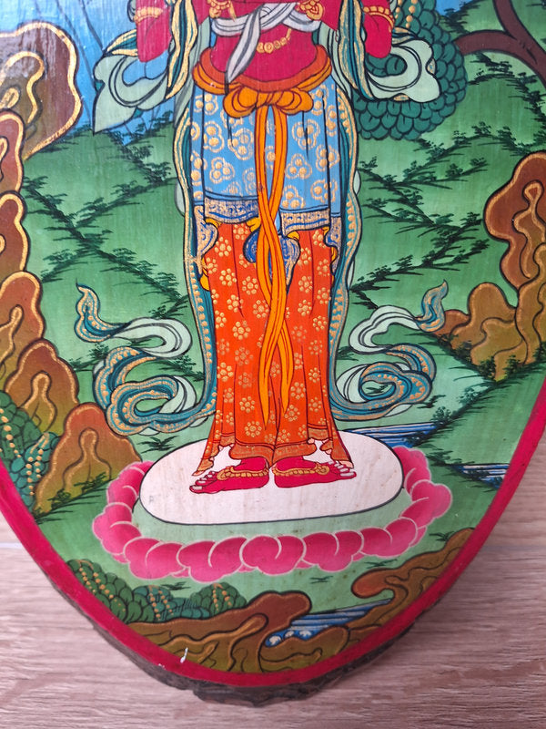 Peinture népalaise sur une tranche de bois d'Avalokiteshvara, bodhisattva de la compassion dans le bouddhisme Mahayana.