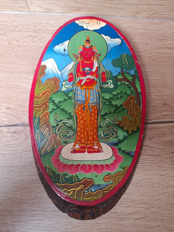 Peinture népalaise sur une tranche de bois d'Avalokiteshvara, bodhisattva de la compassion dans le bouddhisme Mahayana.