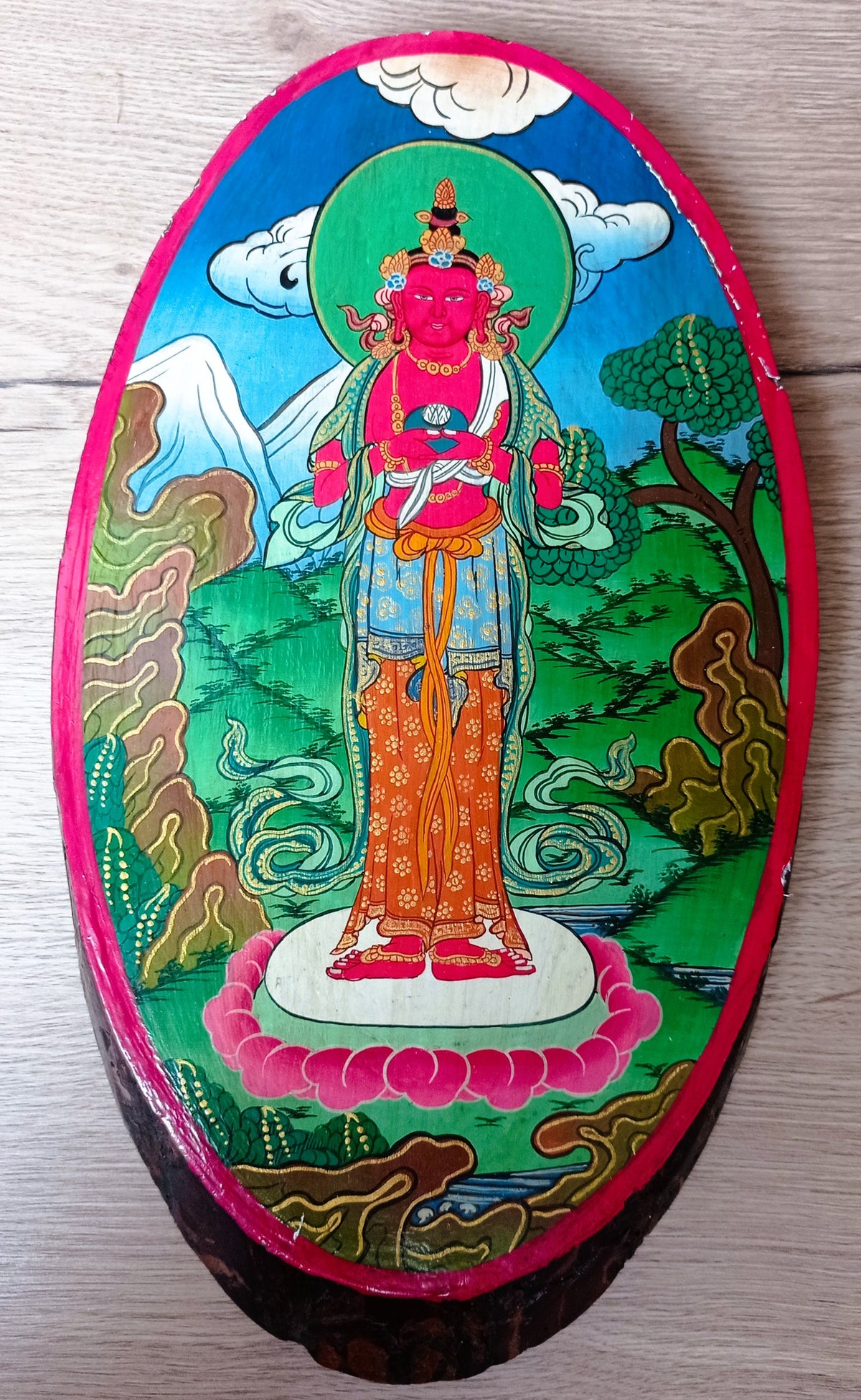 Peinture népalaise sur une tranche de bois d'Avalokiteshvara, bodhisattva de la compassion dans le bouddhisme Mahayana.